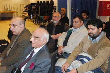 Mustansir Mir and Ghulam Sabir sitting with audience
